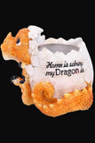 A decorative dragon figurine emerging from a cracked egg, with the phrase 'Home is where my Dragon is' printed on the shell, shown on a plain white background.